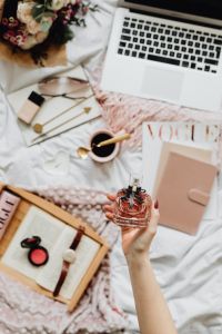 Kaboompics - Home Office Flat Lay with Laptop, Cosmetics and a Perfume Bottle