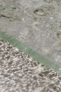 Kaboompics - Bubbled Glass Texture Divided by a Pale Green Diagonal Seam