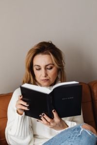 Kaboompics - Bible Study Portrait of Woman on a Brown Leather Sofa