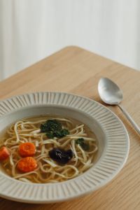 Kaboompics - Chicken Broth Bowl with Noodles, Carrots and Parsley