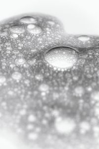Kaboompics - Soft-Focus Cosmetic Foam Bubbles and White Liquid Texture, Vertical Macro Background