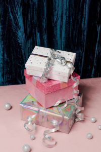 Kaboompics - Stacked Pink and Holographic Gift Boxes