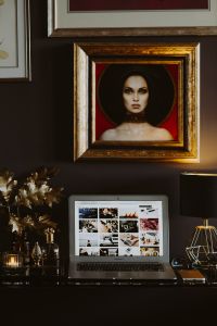 Kaboompics - Home Office Interior with Laptop, Framed Portrait and Gold Lamp