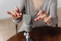 Kaboompics - Woman Snapping Fingers beside a Silver Microphone for ASMR Trigger Sounds