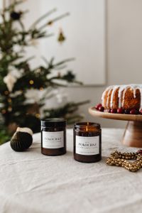 Kaboompics - Christmas Cake and Candle Jars on Festive Table