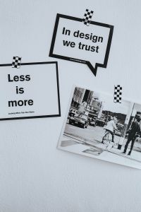 Kaboompics - Close-Up Graphic Design Posters: “In Design We Trust” and “Less Is More” Typography