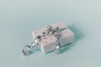 Kaboompics - Small White Christmas Gift with Silver Ribbon