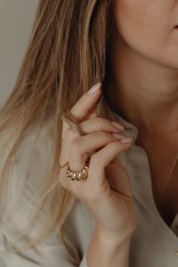 Kaboompics - Woman Wearing Long Earring and Gold Ring