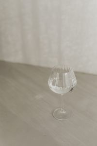 Kaboompics - Small Glass of Water with Minimal Neutral Background and Copy Space