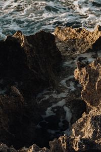 Kaboompics - Large Ocean Wave Splashing Against Dark Rocks