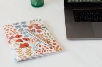 Kaboompics - Be True to You Journal and Monthly Planner in a Laptop Workspace