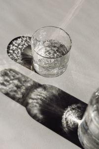 Kaboompics - Clear Water Glass in a Shadow-Cast Still Life