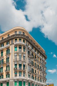 Kaboompics - Ornate Naples Apartment Building With Green Shutters Under Blue Sky