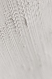 Kaboompics - Blurred Diagonal Brush Marks in Pale Gray Paint