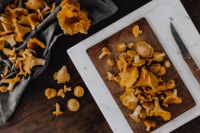 Kaboompics - Prepared Chanterelle Mushrooms On Wooden Cutting Board