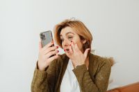 Kaboompics - Close-Up At-Home Makeup Application While Looking into a Smartphone