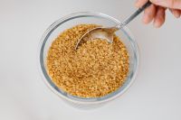 Kaboompics - Top View of Dry Bulgur Wheat in a Glass Bowl with a Serving Spoon