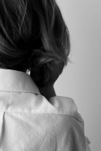 Kaboompics - Faceless Woman With Hair in a Low Bun in Monochrome