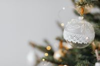 Kaboompics - White Lace Ornament on Christmas Tree with Copy Space