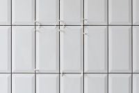 Kaboompics - Laying white ceramic tiles in the bathroom