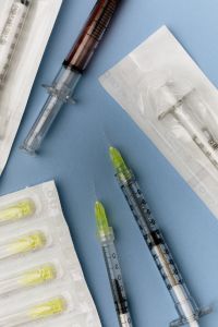Kaboompics - Medical Syringes and Packaged Injection Needle