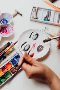 Kaboompics - A woman paints with watercolors