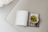 Kaboompics - Overhead Neutral Lifestyle Still Life of Grapes and Open Magazine