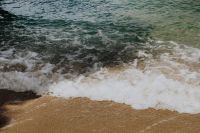Kaboompics - Ocean Wave Breaking Along Sandy Shore