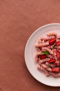 Kaboompics - Strawberry Pasta Composition With Coral Negative Space