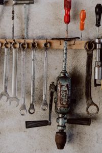 Ring and Open-End Wrenches Hanging in a Rustic Garage Workshop