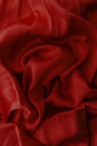 Kaboompics - Deep Red Satin Fabric With Draped Folds