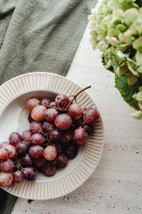 Kaboompics - Grapes in a Bowl with Hydrangeas and Linen Table Decor