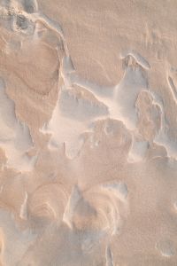Kaboompics - Close-Up of Wind-Formed Sand Edges and Pale Beach Patterns, Natural Background