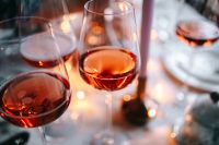 Kaboompics - Rose Wine Glasses and Candle on a Bright Christmas Table Setting