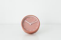 Kaboompics - Close-Up Rose-Pink Round Desk Clock on a Bright White Tabletop with Open Copy Space