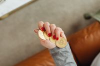 Kaboompics - Hand Holding Bitcoin Coins From Above