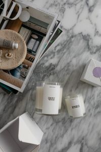 Kaboompics - Luxury Candles Beside an Open Lifestyle Magazine