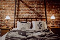 Kaboompics - Enjoying evening with a Macbook in a nice bed