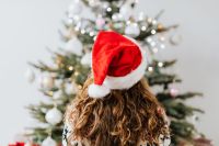 Kaboompics - Woman Wearing Santa Hat in Front of Tree