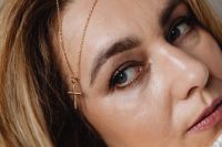 Kaboompics - Close-Up Portrait with Gold Cross Necklace Draped by Her Face