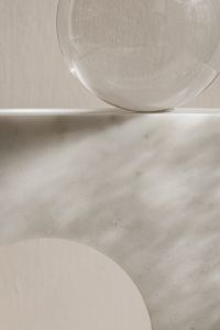 Kaboompics - Marble Arch and Glass Sphere Behind Ribbed Glass