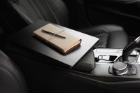 Kaboompics - Beige Notebooks and Pen on a Car Center Console