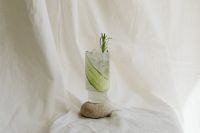 Kaboompics - Green Cocktail with Lime and Rosemary on a Round Table