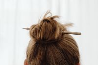 Kaboompics - Pencil Secured in a Textured High Bun