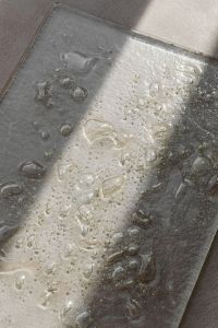 Kaboompics - Glass Texture Panel with Bubbles and Diagonal Light Shadow