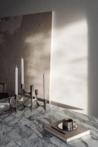 Kaboompics - Arabescato Marble Table with Metal Coffee Cup and Candleholder
