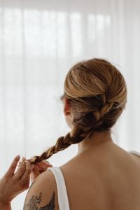 Kaboompics - Woman Holding a Long Braid from Behind