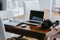 Kaboompics - Laptop with Smartphone, DSLR Camera and Magazine on a Wood Desk