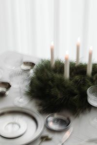 Kaboompics - Close Up Crystal Coupe Glasses, Silver Bowl and Advent Wreath on White Table