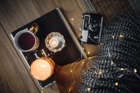 Kaboompics - Old camera, mug with tea and books